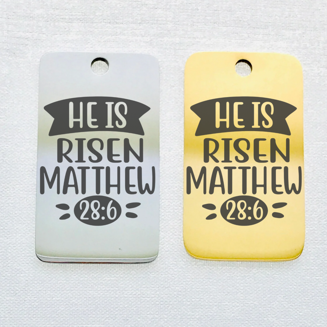 HE IS RISEN STAINLESS STEEL CHARM